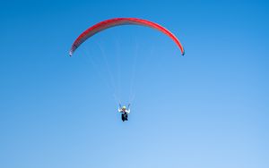 Preview wallpaper paragliding, flight, buildings, sea, city