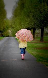 Preview wallpaper park, umbrella, tree, road, walking, cloudy