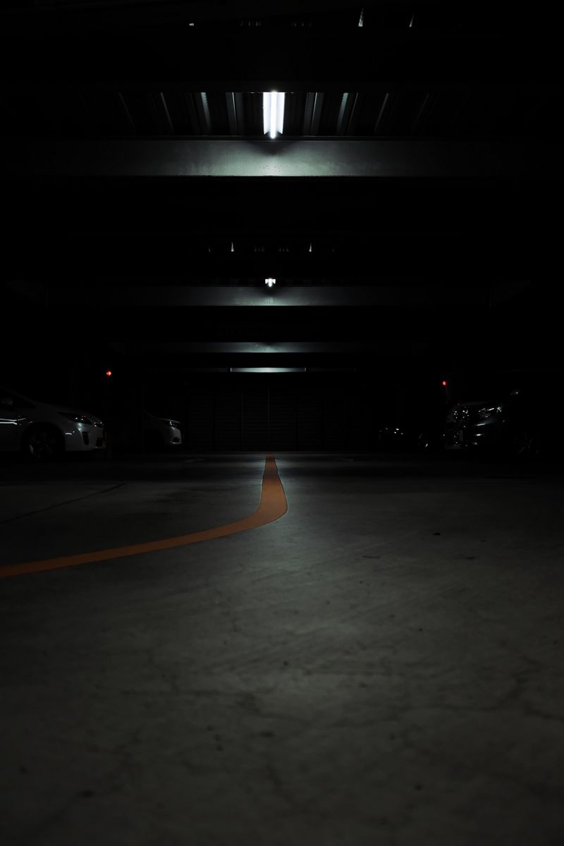 800x1200 Wallpaper parking, cars, lamps, glow, dark
