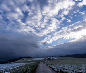 Preview wallpaper pathway, field, clouds, snow, winter, forest, house