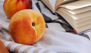 Preview wallpaper peach, fruit, book, page, cloth