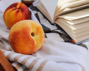 Preview wallpaper peach, fruit, book, page, cloth