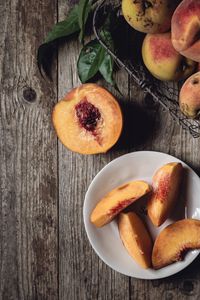 Preview wallpaper peach, fruit, wooden, plate