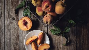 Preview wallpaper peach, fruit, wooden, plate