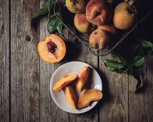 Preview wallpaper peach, fruit, wooden, plate