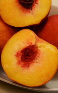 Preview wallpaper peaches, fruit, slice, ripe, juicy