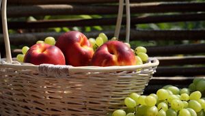 Preview wallpaper peaches, grapes, basket, crop