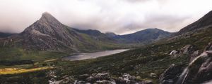 Preview wallpaper peak, mountains, stones, flowers, landscape