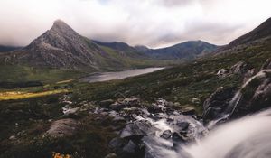 Preview wallpaper peak, mountains, stones, flowers, landscape