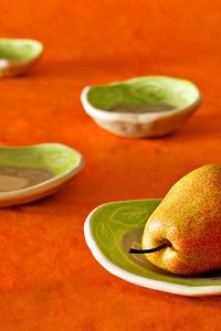 Preview wallpaper pear, plates, fruit, orange