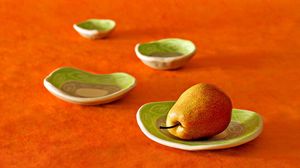 Preview wallpaper pear, plates, fruit, orange