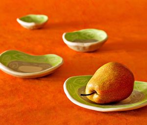 Preview wallpaper pear, plates, fruit, orange