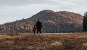 Preview wallpaper people, hill, forest, landscape, puddle, reflection
