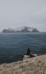 Preview wallpaper people, rocks, sea, grass, solitude, loneliness