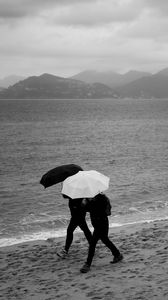 Preview wallpaper people, umbrellas, rain, sea, beach