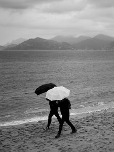 Preview wallpaper people, umbrellas, rain, sea, beach