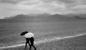 Preview wallpaper people, umbrellas, rain, sea, beach