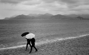 Preview wallpaper people, umbrellas, rain, sea, beach