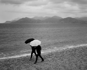 Preview wallpaper people, umbrellas, rain, sea, beach
