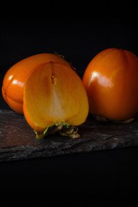 Preview wallpaper persimmon, fruit, ripe, slice