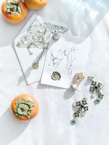 Preview wallpaper persimmon, fruits, crosses, earrings, jewelry, aesthetics