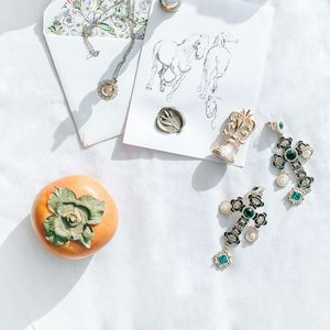 Preview wallpaper persimmon, fruits, crosses, earrings, jewelry, aesthetics