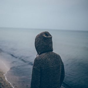 Preview wallpaper person, silhouette, alone, sad, hood, beach, sea