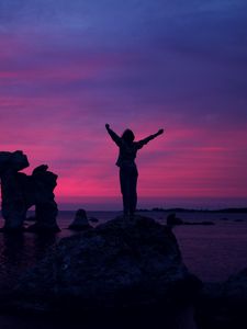 Preview wallpaper person, sunset, rocks, sea, happiness, freedom