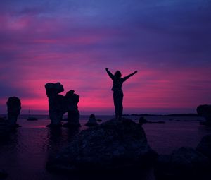 Preview wallpaper person, sunset, rocks, sea, happiness, freedom