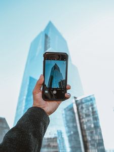 Preview wallpaper phone, camera, hand, building, city