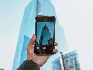 Preview wallpaper phone, camera, hand, building, city