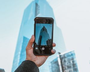 Preview wallpaper phone, camera, hand, building, city