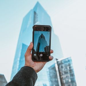 Preview wallpaper phone, camera, hand, building, city