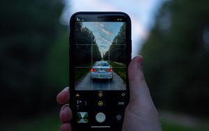Preview wallpaper phone, camera, hand, car