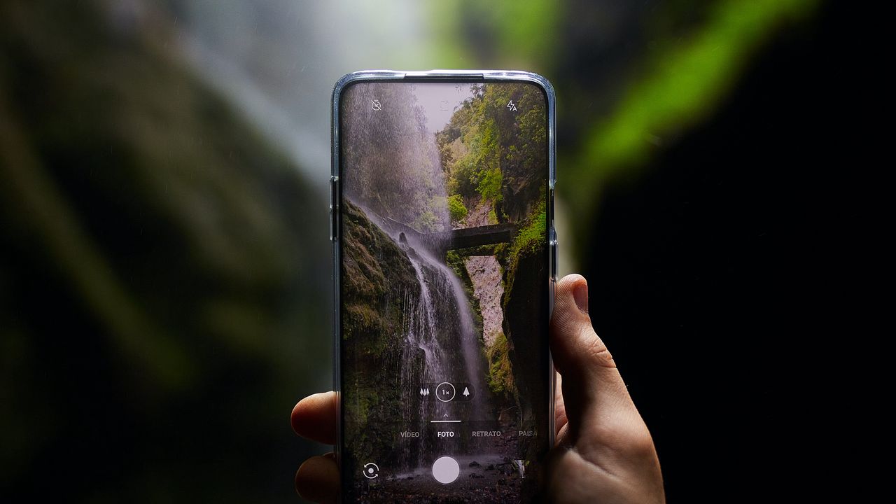 Wallpaper phone, camera, hand, waterfall