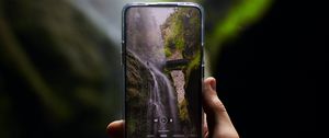 Preview wallpaper phone, camera, hand, waterfall