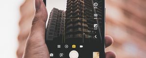 Preview wallpaper phone, hand, building, photo