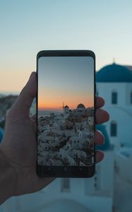 Preview wallpaper phone, hand, camera, city, sunset