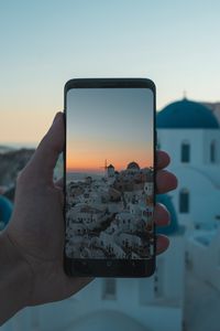 Preview wallpaper phone, hand, camera, city, sunset