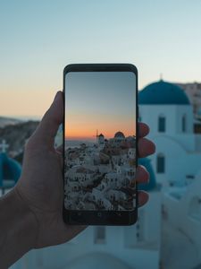 Preview wallpaper phone, hand, camera, city, sunset