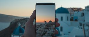 Preview wallpaper phone, hand, camera, city, sunset