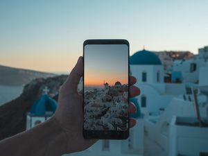 Preview wallpaper phone, hand, camera, city, sunset