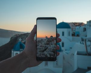 Preview wallpaper phone, hand, camera, city, sunset