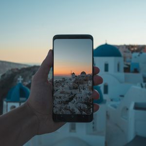 Preview wallpaper phone, hand, camera, city, sunset