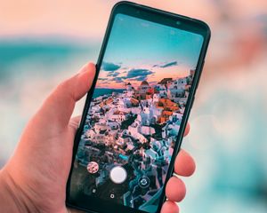 Preview wallpaper phone, hand, city, camera