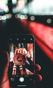 Preview wallpaper phone, hand, photo, focus, blur, bokeh