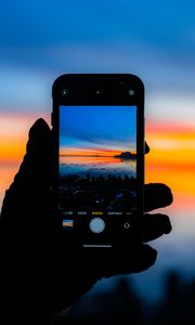 Preview wallpaper phone, hand, photo, sunset, dark