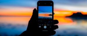 Preview wallpaper phone, hand, photo, sunset, dark