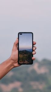 Preview wallpaper phone, hand, photo, mountains