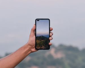 Preview wallpaper phone, hand, photo, mountains